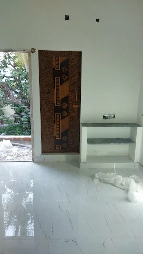 Brown PVC door with geometric decorative panel installed in Avadi