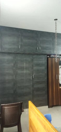 Grey slate-finish full-height PVC cupboard with loft