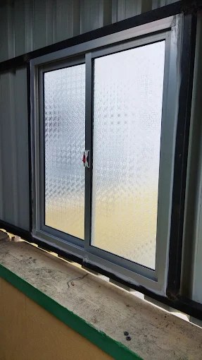 Aluminium frame textured glass window installation