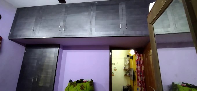 Grey loft overhead storage and cupboard combination
