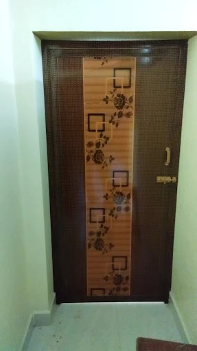 Solid panel PVC door with geometric brown decorative design